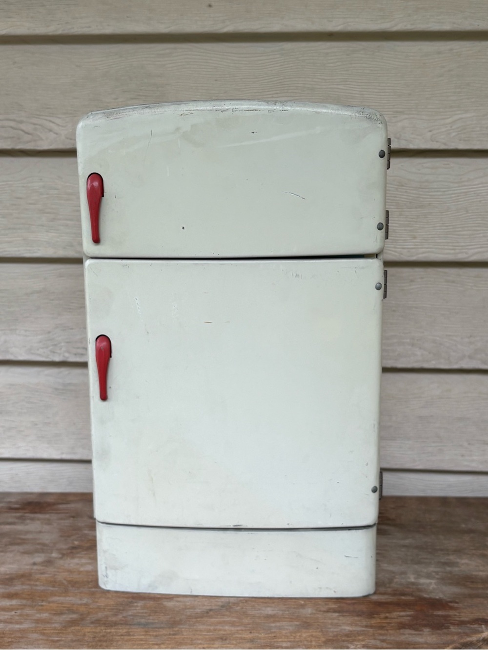 VTG 1950s Wolverine Supply metal toy refrigerator, featuring a white finish